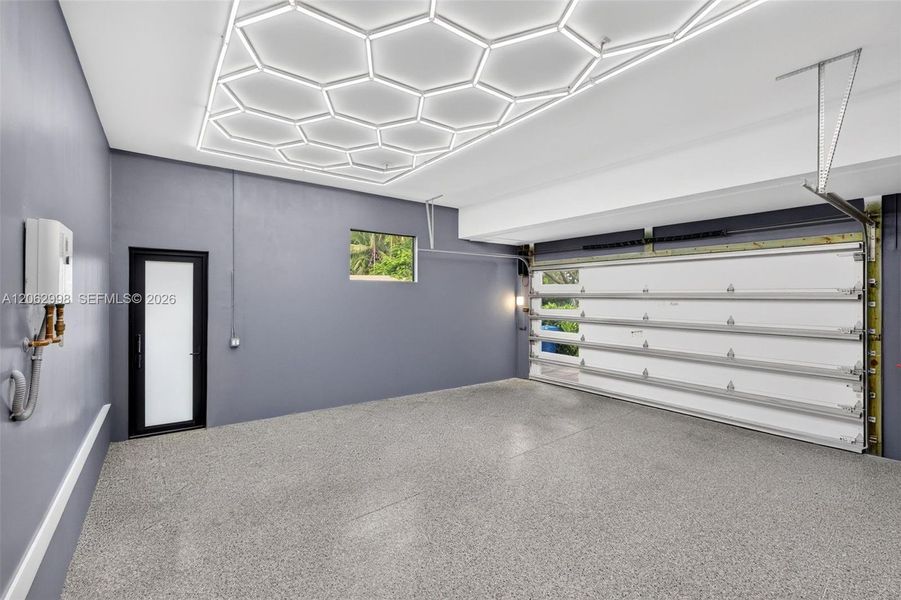 2 car garage with epoxy coated flooring, custom lighting and tankless water heater.