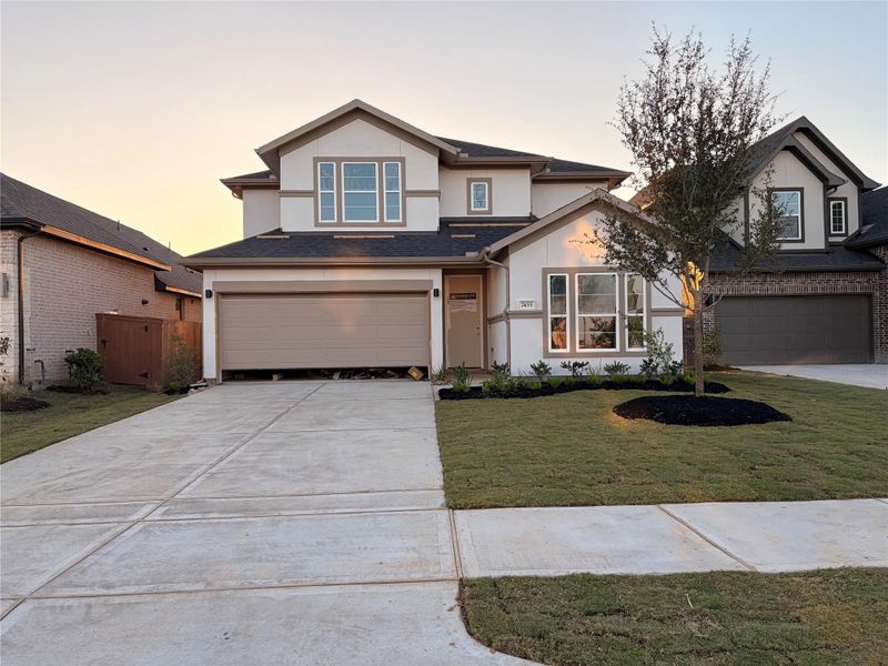 Front exterior of a new home in Elyson 45' & 70', Katy, TX, highlighting curb appeal (Image 2). Front exterior of a new home in Elyson 45' & 70', Katy, TX, highlighting curb appeal (Image 2).
