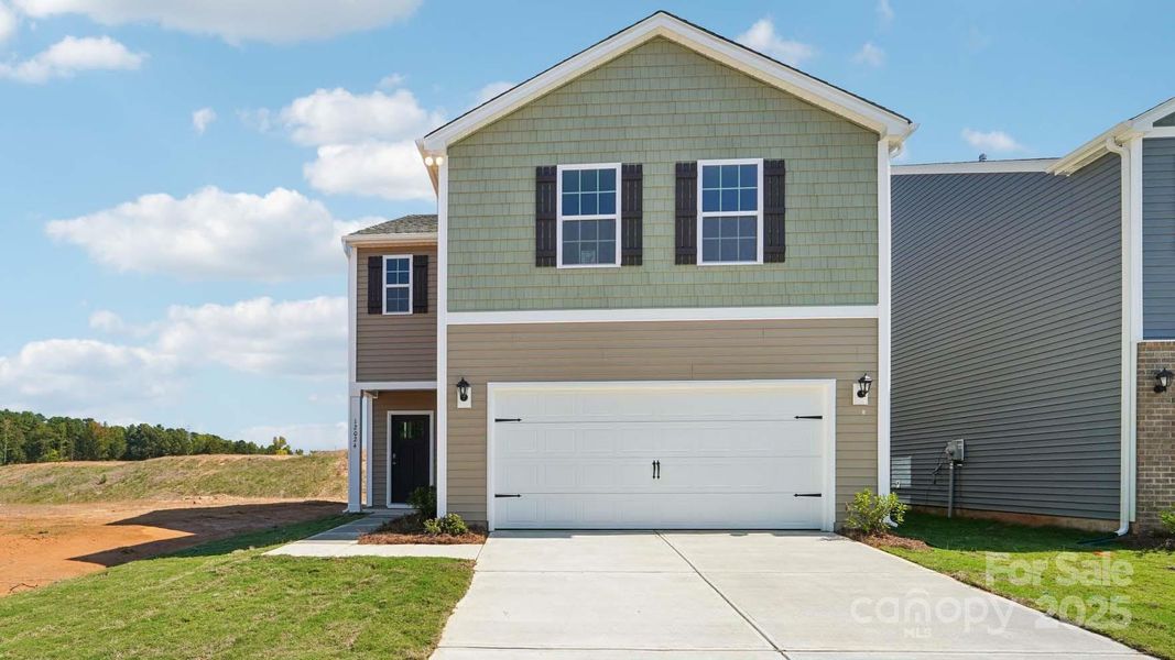 Front exterior of a new home in Cardinal Creek, Charlotte, NC, highlighting curb appeal (Image 1).