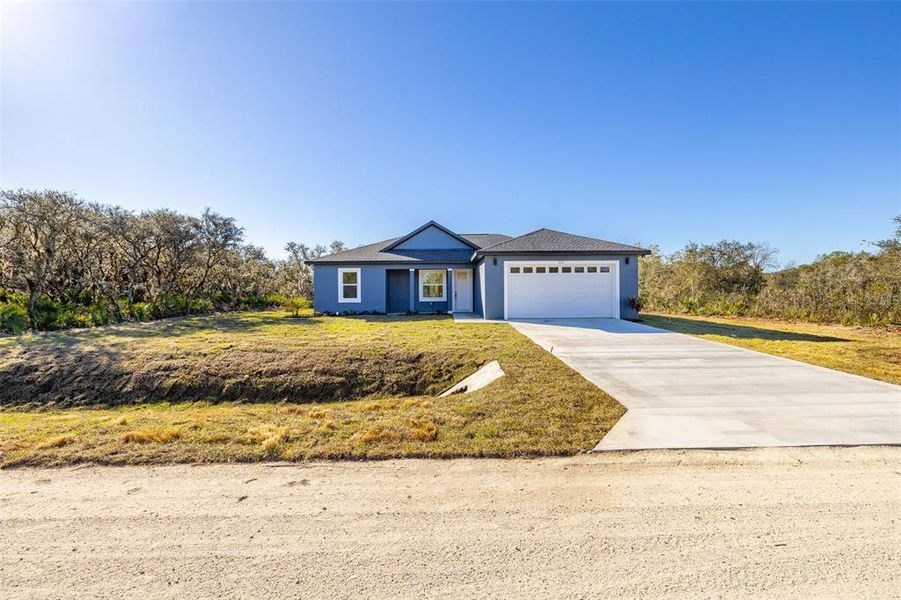 Front exterior of a new home in , Avon Park, FL, highlighting curb appeal (Image 22). Front exterior of a new home in , Avon Park, FL, highlighting curb appeal (Image 22).