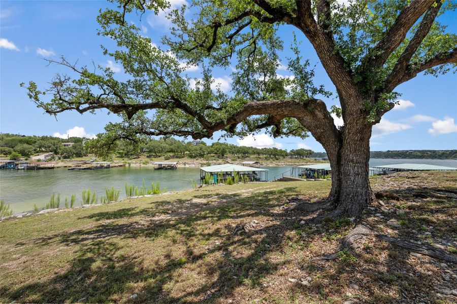 A tranquil lakeside retreat with ample boat slips and mature shade trees. A tranquil lakeside retreat with ample boat slips and mature shade trees.