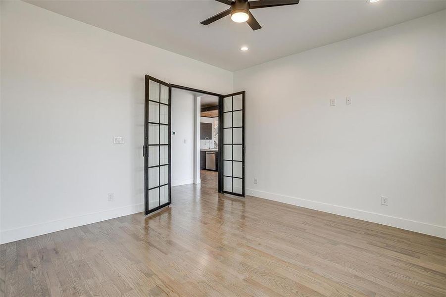 Spare room featuring ceiling fan, baseboards, wood finished floors, and recessed lighting