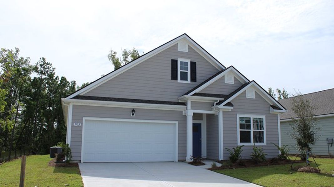 Front exterior of a new home in Kingston Bay, Conway, SC, highlighting curb appeal (Image 2).