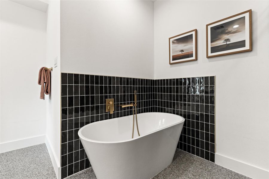 A freestanding soaking tub that's just as sculptural as it is functional. A freestanding soaking tub that's just as sculptural as it is functional.