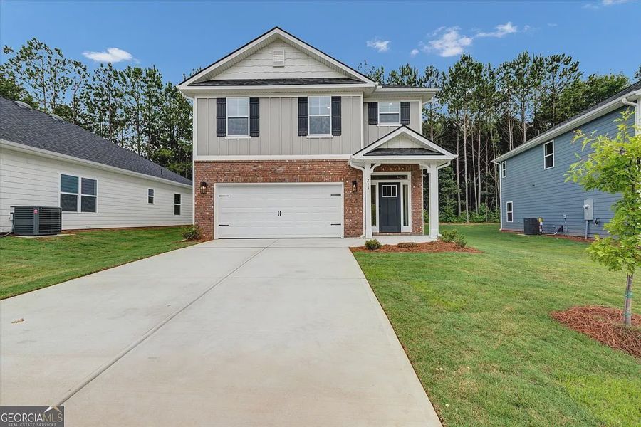 Front exterior of a new home in Canterbury Villas, Carrollton, GA, highlighting curb appeal (Image 21). Front exterior of a new home in Canterbury Villas, Carrollton, GA, highlighting curb appeal (Image 21).