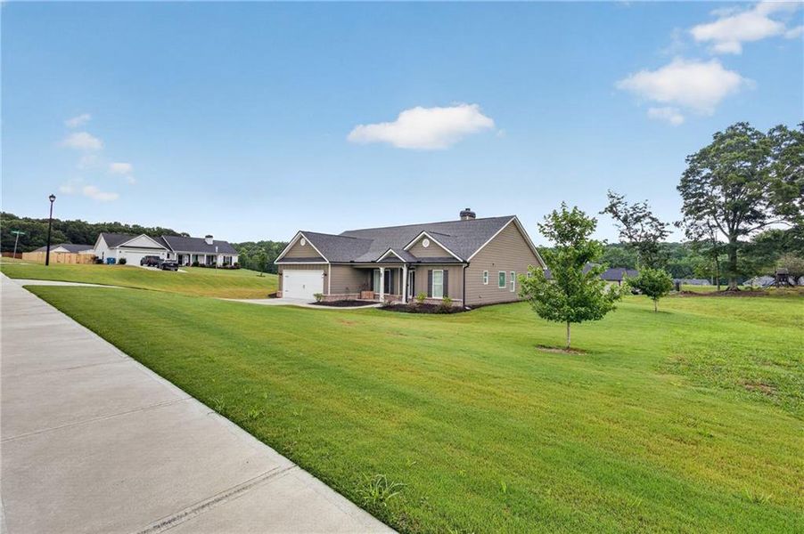 Front exterior of a new home in , Winder, GA, highlighting curb appeal (Image 27).