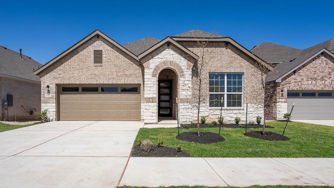 Front exterior of a new home in Rosenbusch Ranch, Leander, TX, highlighting curb appeal (Image 19). Front exterior of a new home in Rosenbusch Ranch, Leander, TX, highlighting curb appeal (Image 19).