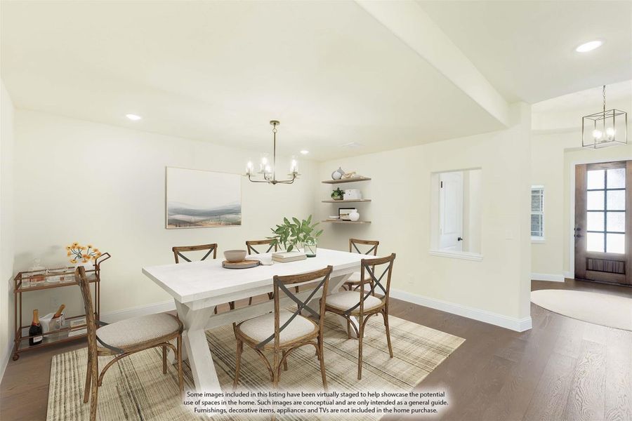 Dining room with white farmhouse table, wood chairs, chandelier, and hardwood floors Dining room with white farmhouse table, wood chairs, chandelier, and hardwood floors