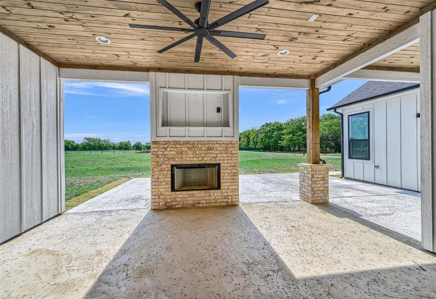 View of patio featuring ceiling fan