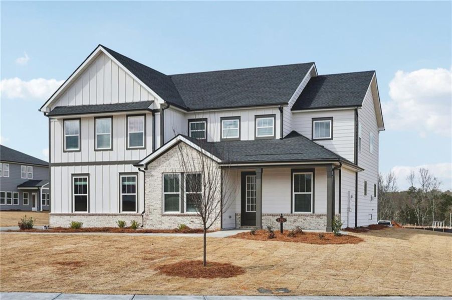Front exterior of a new home in River Pointe, Monroe, GA, highlighting curb appeal (Image 25).