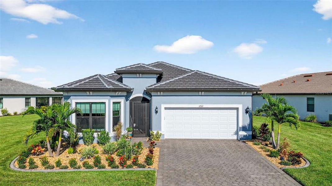 Front exterior of a new home in , Venice, FL, highlighting curb appeal (Image 1).