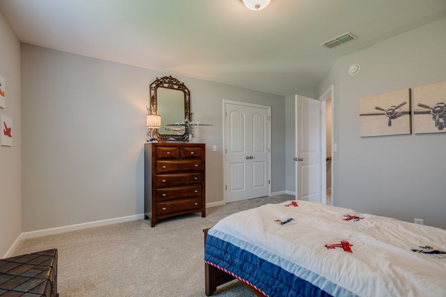 Secondary Bedroom upstairs with a HUGE closet & attic storage space!