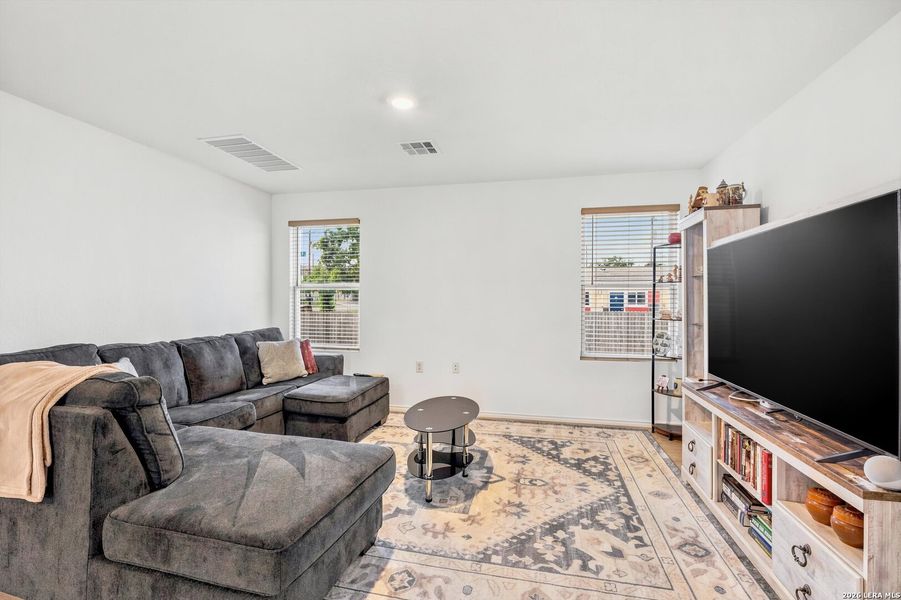 Furnished interior view inside a new home in Tarasco Gardens, San Antonio (Image 7).