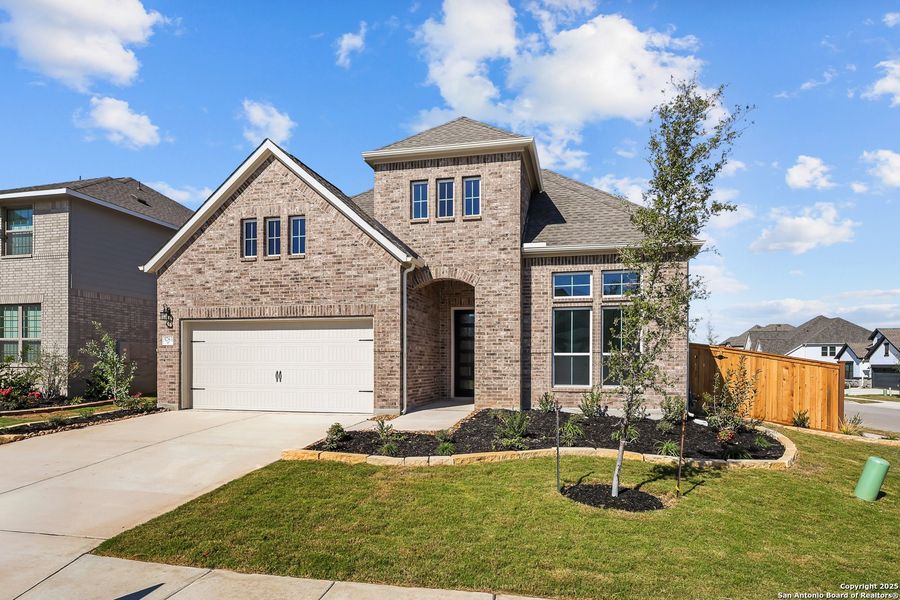 Front exterior of a new home in Mayfair 60', New Braunfels, TX, highlighting curb appeal (Image 26).