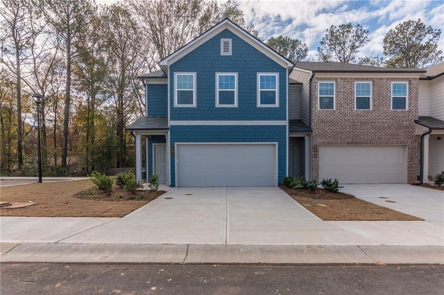 Front exterior of a new home in Laurelwood, Douglasville, GA, highlighting curb appeal (Image 27).