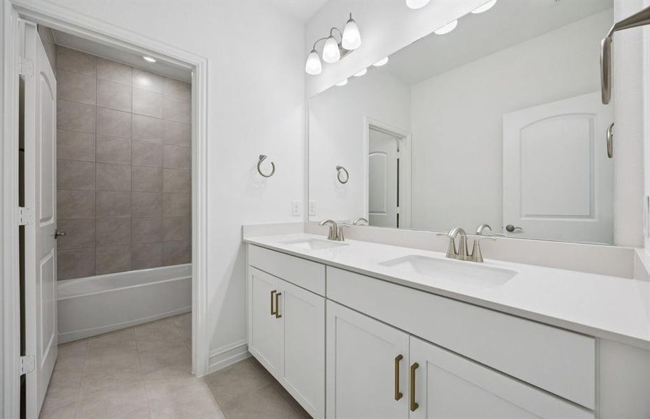 Secondary bathroom with double vanity and premium finishes Secondary bathroom with double vanity and premium finishes