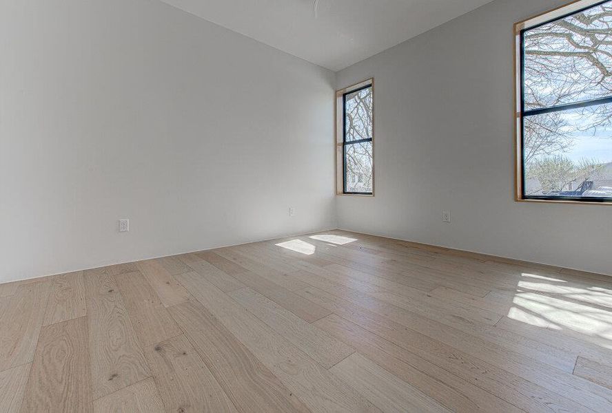 Unfurnished room featuring light wood-type flooring