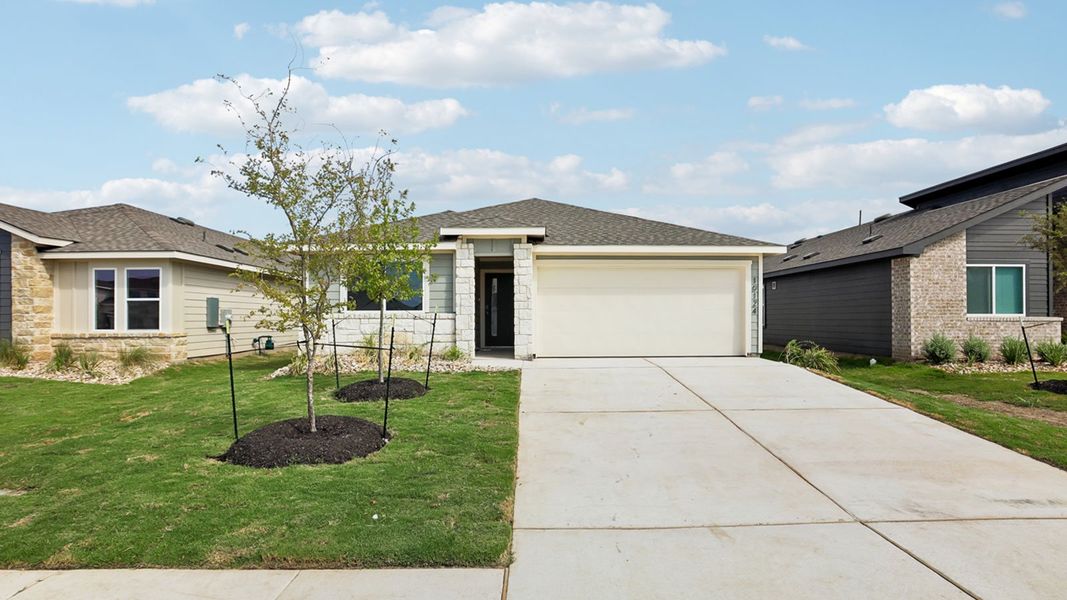 Front exterior of a new home in Trails at Wildhorse, Austin, TX, highlighting curb appeal (Image 16). Front exterior of a new home in Trails at Wildhorse, Austin, TX, highlighting curb appeal (Image 16).