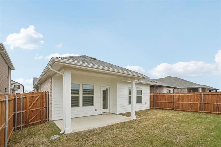Exterior details and patio area of a home in Parks at Foster Crossing - Spring Series, Anna (Image 4).