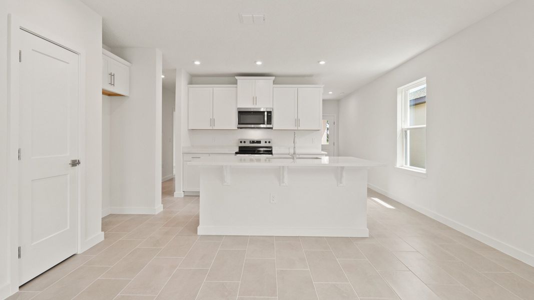 Furnished interior view inside a new home in Grasslands West, Lakeland (Image 18).