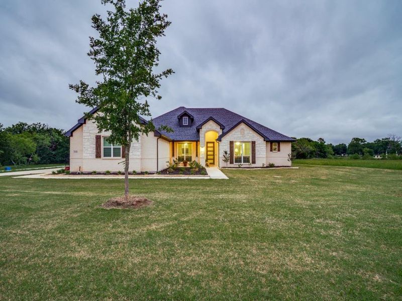 Front exterior of a new home in Vista Oaks Estates, Royse City, TX, highlighting curb appeal (Image 21).
