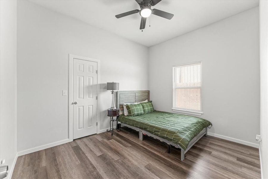 Bedroom featuring wood finished floors and a ceiling fan