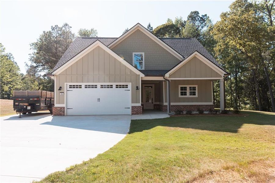 Front exterior of a new home in , Covington, GA, highlighting curb appeal (Image 1). Front exterior of a new home in , Covington, GA, highlighting curb appeal (Image 1).