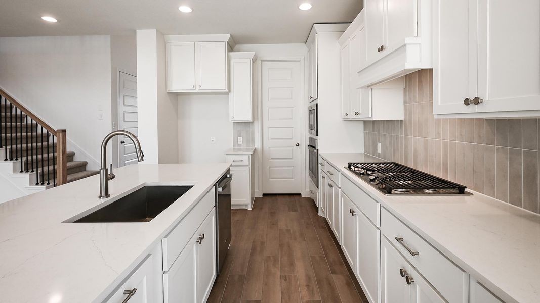 Furnished interior view inside a new home in 6 Creeks, Kyle (Image 10).