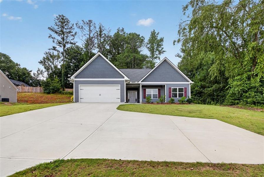 Front exterior of a new home in , Dallas, GA, highlighting curb appeal (Image 21). Front exterior of a new home in , Dallas, GA, highlighting curb appeal (Image 21).