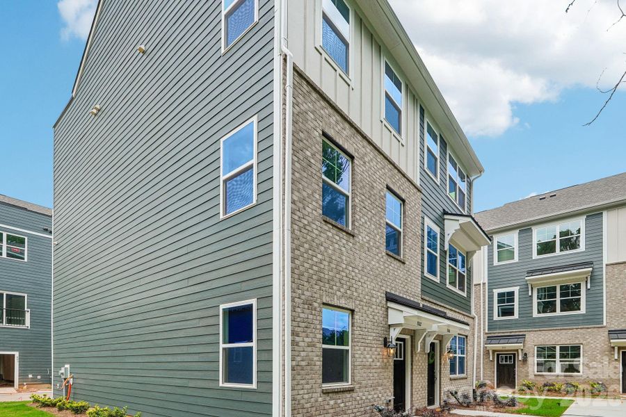 Exterior details and patio area of a home in Anderson Street Townhomes, Charlotte (Image 28).