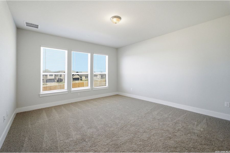 Spacious, unfurnished interior of a new home in The Woodlands at Medina Hills, Mico (Image 26).