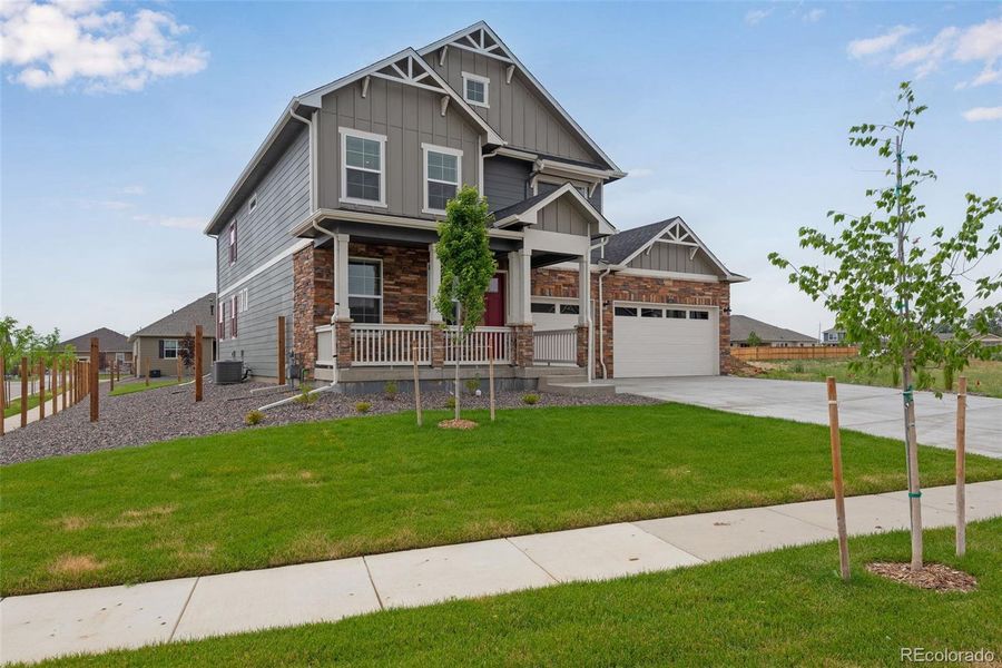 Front exterior of a new home in Vantage, Berthoud, CO, highlighting curb appeal (Image 26).
