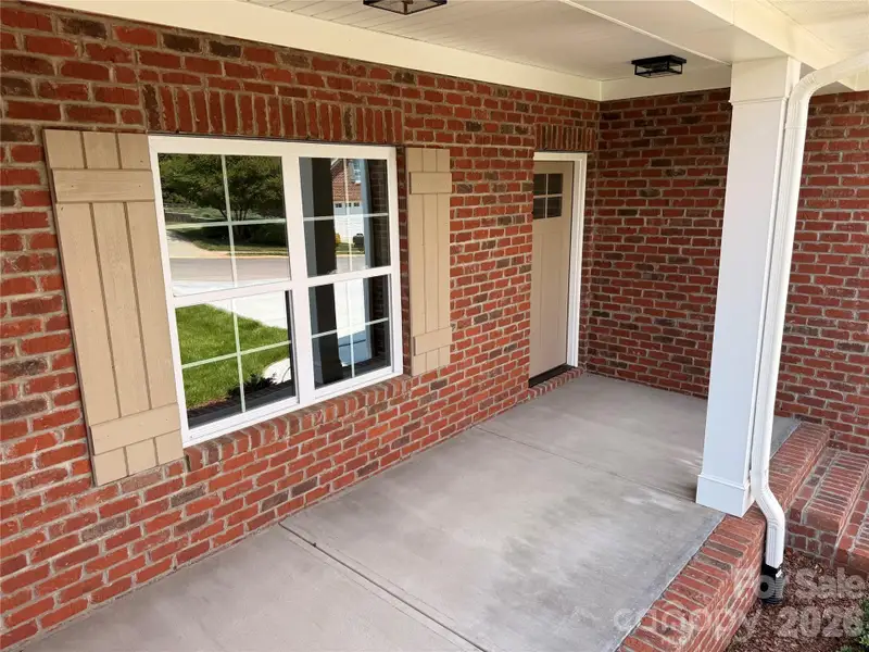 Beautiful shutters and front door plus plenty of room for seating