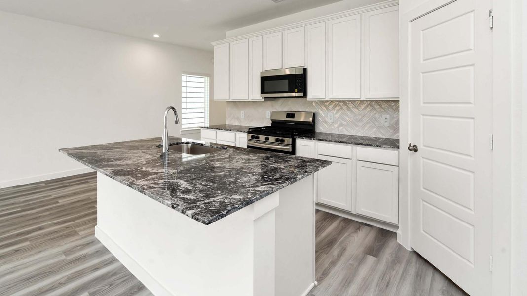 Furnished interior view inside a new home in Grand West, Houston (Image 4).