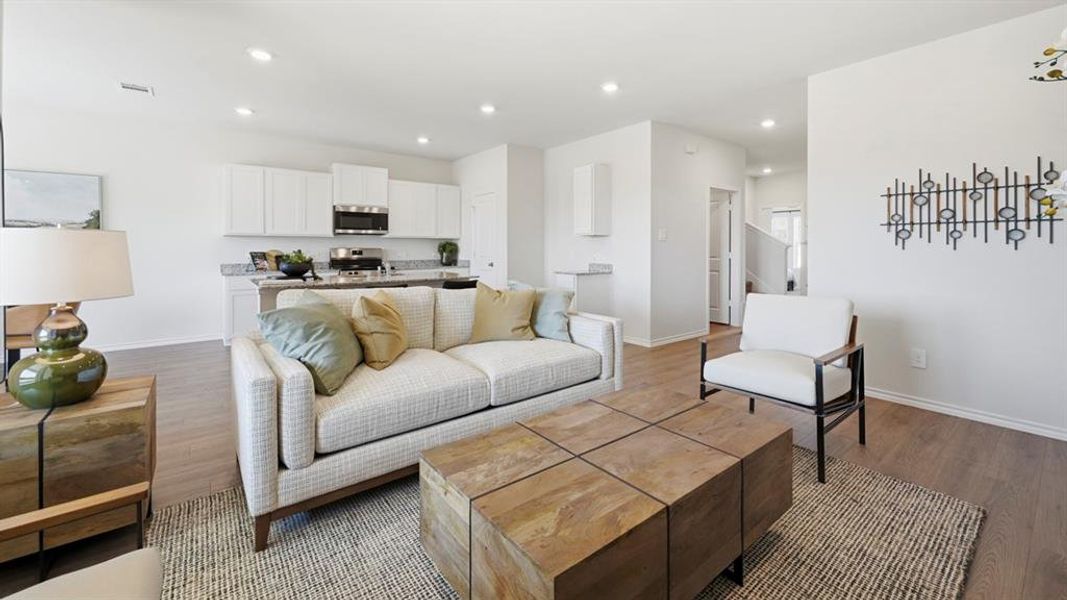 Living room with wood finished floors and recessed lighting Living room with wood finished floors and recessed lighting