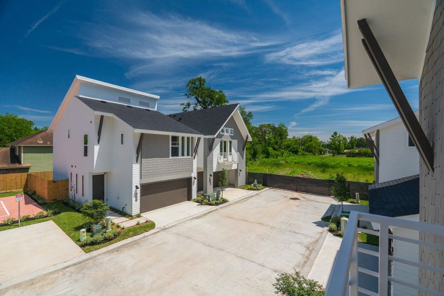 Modern townhomes with sleek designs and sloped roofs, situated in a quiet, landscaped cul-de-sac. Spacious driveways and a lush green backdrop offer a serene environment.Photo Disclaimer: Photos are representative of the community and may depict a similar floor plan, model home, or previously completed residence. Modern townhomes with sleek designs and sloped roofs, situated in a quiet, landscaped cul-de-sac. Spacious driveways and a lush green backdrop offer a serene environment.Photo Disclaimer: Photos are representative of the community and may depict a similar floor plan, model home, or previously completed residence.