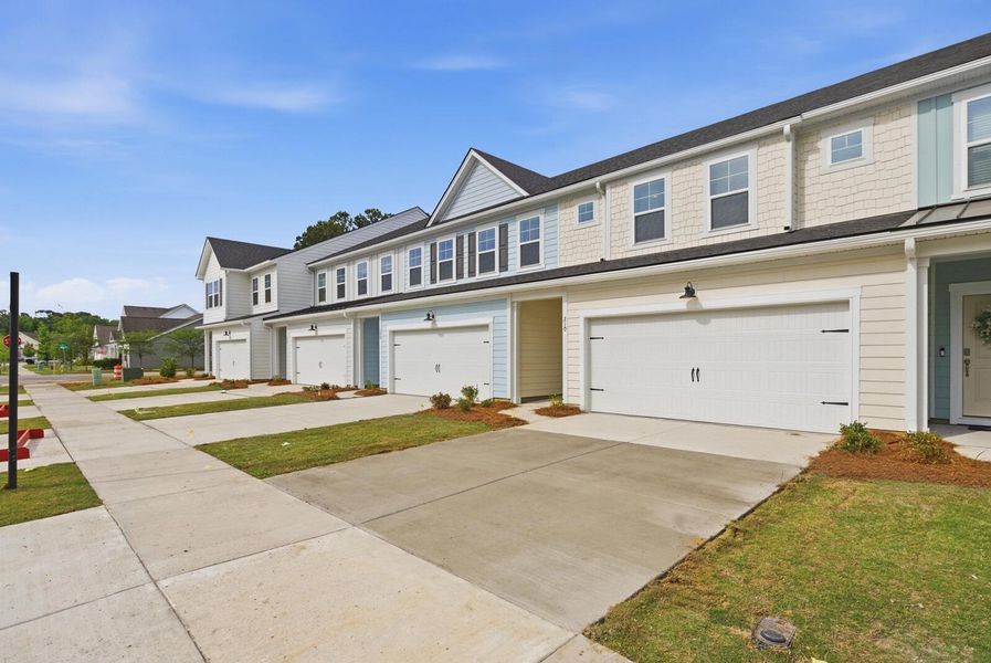 Front exterior of a new home in Ashley Walk Townes, Charleston, SC, highlighting curb appeal (Image 29). Front exterior of a new home in Ashley Walk Townes, Charleston, SC, highlighting curb appeal (Image 29).
