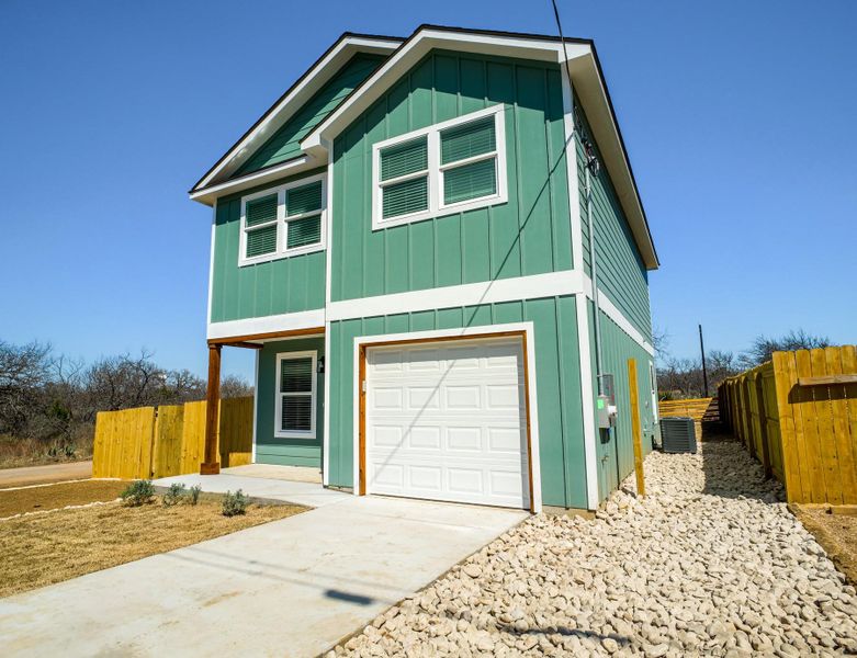 Front exterior of a new home in , Granite Shoals, TX, highlighting curb appeal (Image 19).