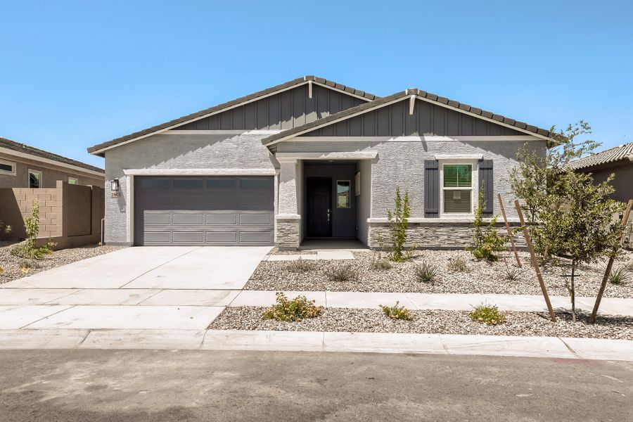 Front exterior of a new home in Asante Artisan, Surprise, AZ, highlighting curb appeal (Image 1). Front exterior of a new home in Asante Artisan, Surprise, AZ, highlighting curb appeal (Image 1).