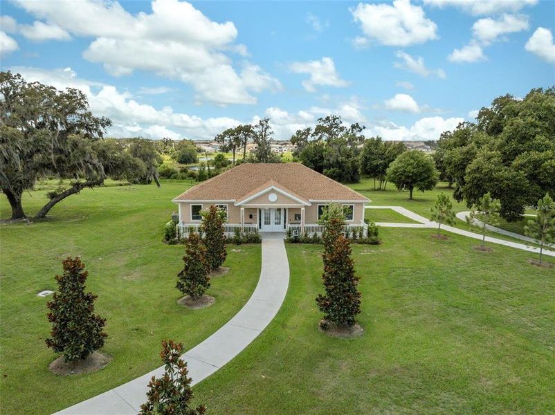 Front exterior of a new home in Epperson, Wesley Chapel, FL, highlighting curb appeal (Image 26). Front exterior of a new home in Epperson, Wesley Chapel, FL, highlighting curb appeal (Image 26).