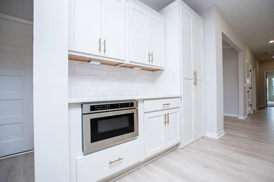Furnished interior view inside a new home in WOODMONT RESERVE, Roopville (Image 7).