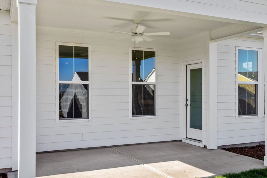 Exterior details and patio area of a home in Ovation at Sweetbrier, Durham (Image 3).