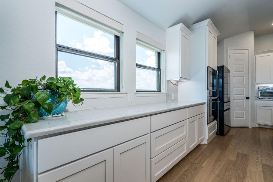 Note the fantastic bank of cabinets that Perry includes in their kitchen design. So much unbeatable kitchen storage and a great buffet counter for serving as well. Note the fantastic bank of cabinets that Perry includes in their kitchen design. So much unbeatable kitchen storage and a great buffet counter for serving as well.