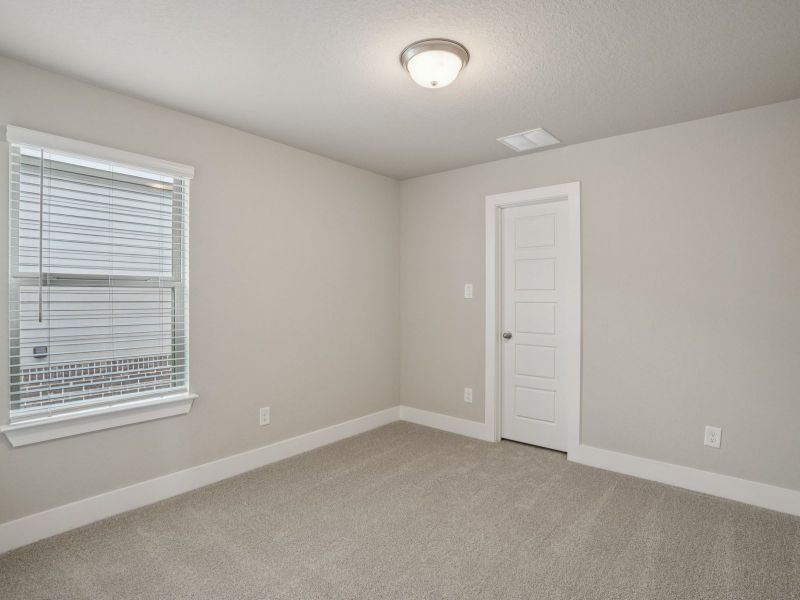Secondary Bedroom in the Medina floorplan at a Meritage Homes community. Secondary Bedroom in the Medina floorplan at a Meritage Homes community.