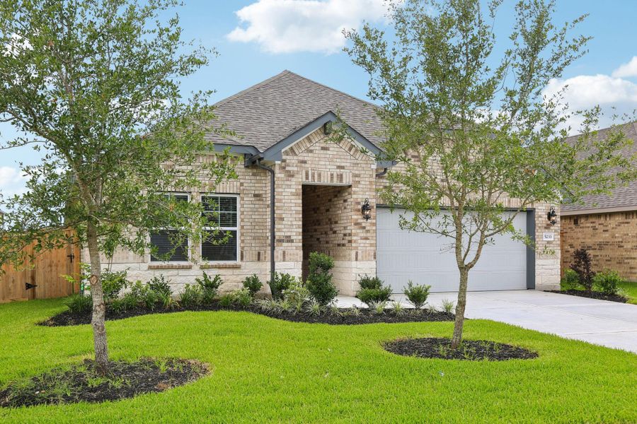 Front exterior of a new home in Massey Oaks - Premier Series, Pearland, TX, highlighting curb appeal (Image 2). Front exterior of a new home in Massey Oaks - Premier Series, Pearland, TX, highlighting curb appeal (Image 2).