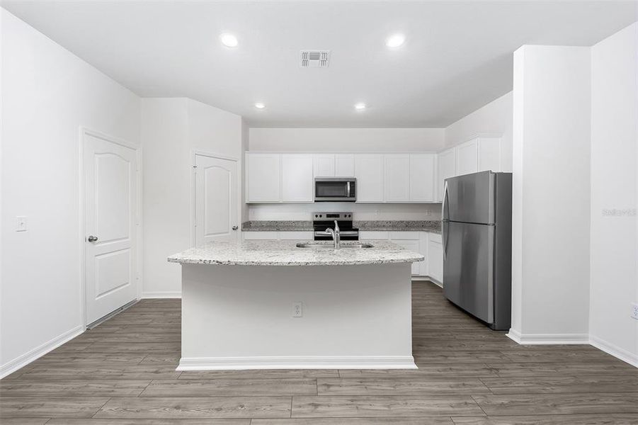 Furnished interior view inside a new home in Tula Parc, Astatula (Image 10).