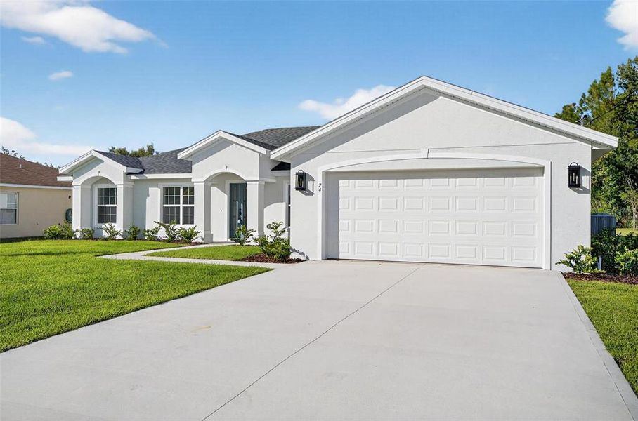 Front exterior of a new home in , Palm Coast, FL, highlighting curb appeal (Image 29).