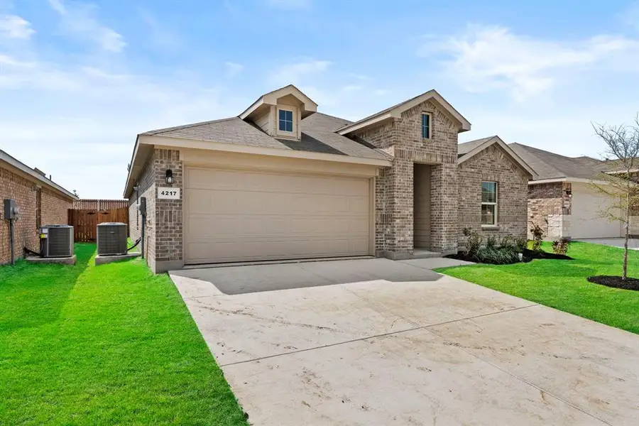 Front exterior of a new home in Sunnycreek, Crowley, TX, highlighting curb appeal (Image 2).