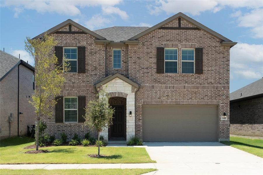 Front exterior of a new home in Lake Pointe: Lake Pointe at Paloma Creek, Little Elm, TX, highlighting curb appeal (Image 1).