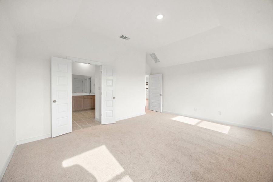 Primary Bedroom in the Turquoise home plan by Trophy Signature Homes – REPRESENTATIVE PHOTO